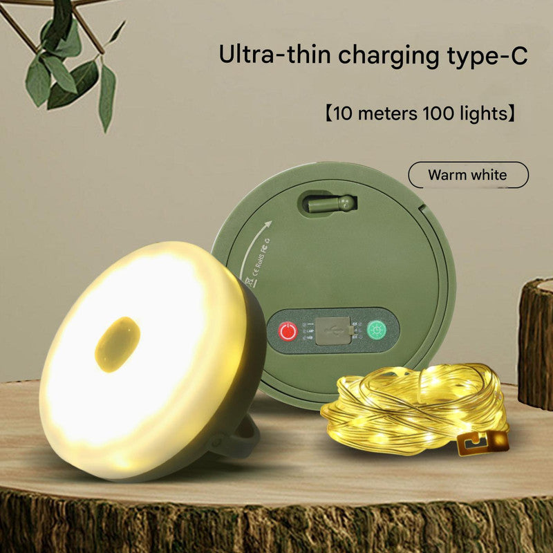 Green camping lantern with warm white retractable string lights