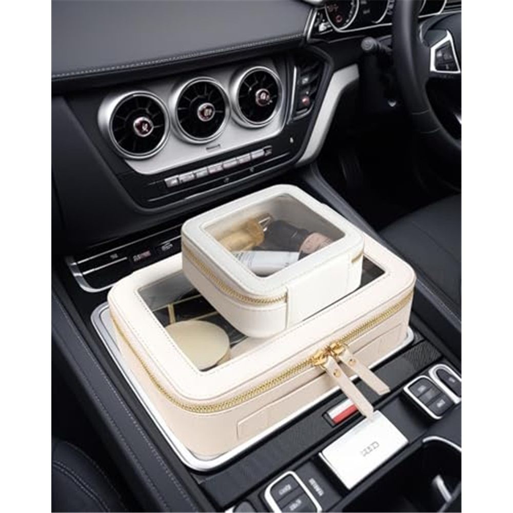 Cream clear-window pouches holding toiletries in a car centre console