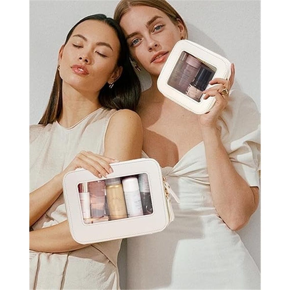 Two people holding cream pouches with cosmetics shown as props