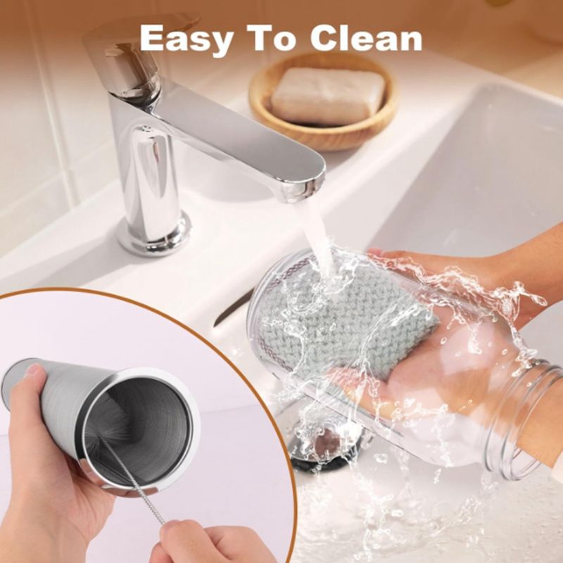 Glass cold brew pitcher being rinsed by hand